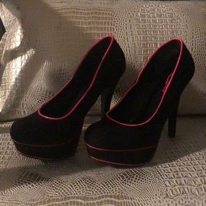 Black and hot pink pumps